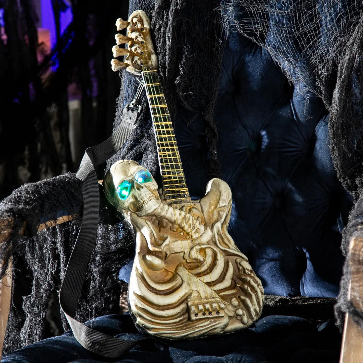2 Ft. Light-Up Ukulele-Shaped Plastic Skeleton Halloween Decoration